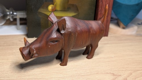 Hand carved wooden warthog - hand,