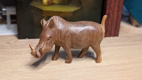 Hand carved wooden warthog - hand,