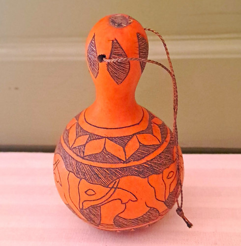 Hand decorated gourd bottle - hand, bottle/