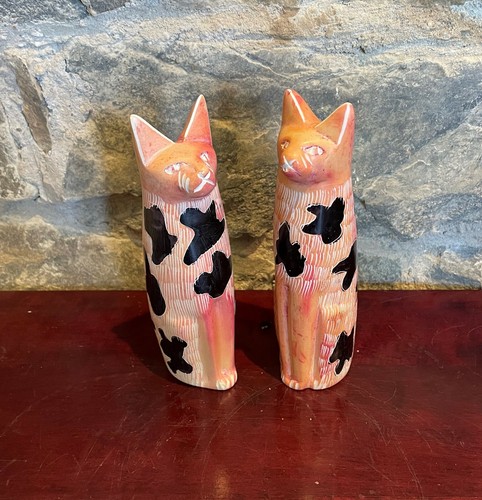 Pair hand carved and - of,